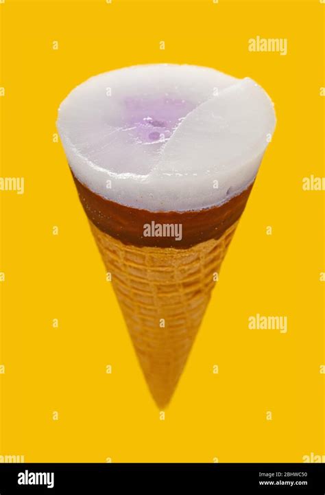 Angle View Sweet Potato Flavor Ice Cream Cone With Frozen Top On Yellow