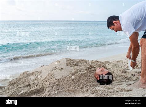 Buried Burying Sand By Water Surf Hi Res Stock Photography And Images