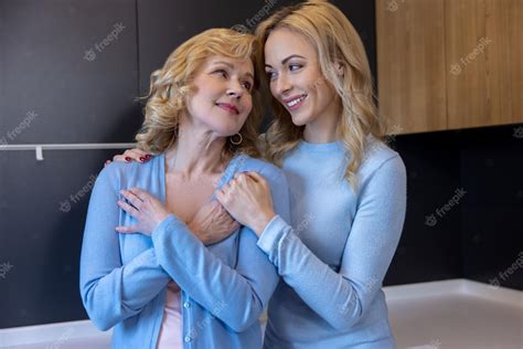 Premium Photo Smiling Happy Adult Daughter Hugging Her Mom