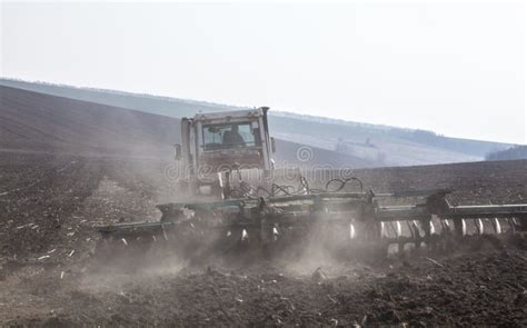 Harrowing the Soil with Disc Harrows Stock Image - Image of humus ...