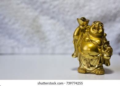 Laughing Buddha God Hotei Gold Figurine Stock Photo