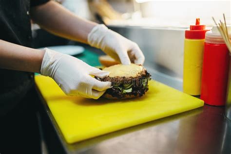 Male Cook Prepares Fast Food Burger Preparation Stock Image Image Of