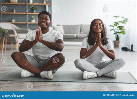 Black Couple Meditating Keeping Hands Together In Prayer Pose Stock