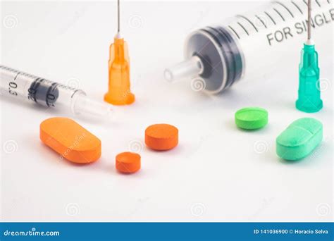 Colorful Pills On White Background Syringes With The Legend Stock