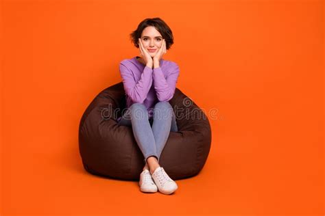 Full Length Photo Of Shiny Dreamy Lady Wear Violet Sweatshirt Sitting