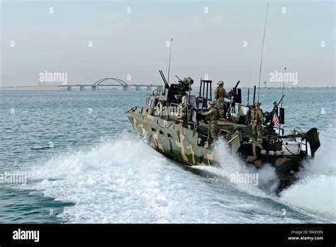 Us Navy Seals Conduct Patrol Operations Aboard A Riverine Command Boat