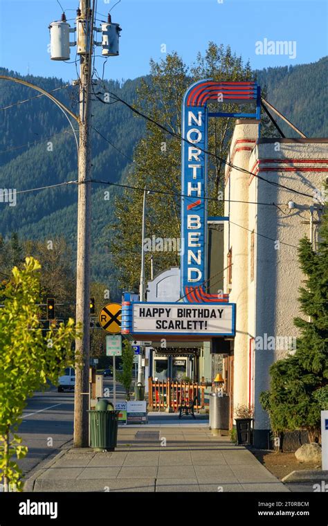 North Bend, WA, USA - October 8, 2023; Sidewalk view of classic North Bend small cinema with ...