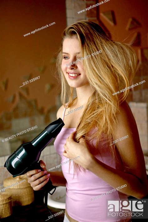 Woman Using Hair Dryer Stock Photo Picture And Rights Managed Image