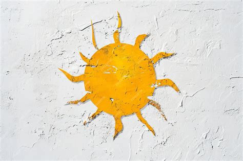 Premium Photo | Sun painted on a white wall Bright yellow sun on a ...