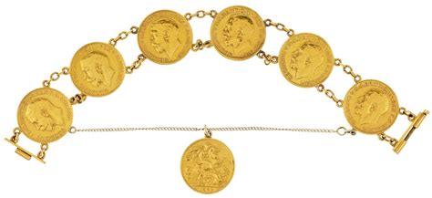 163 A Gold Sovereign Bracelet Seven Sovereigns Mounted In Unmarked Y