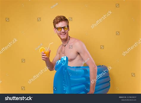 Happy Funny Shirtless Man Holding Cocktail Stock Photo