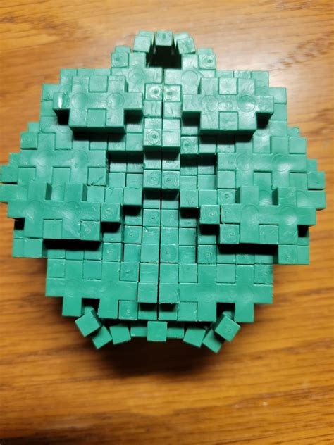 A pixel art of a Minecraft Creeper face. : r/PlusPlusReddit