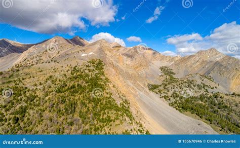 High Rocky Mountains In Central Idaho With White Puffy Clouds Stock