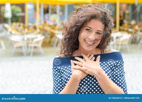 Grateful Young Woman With Her Hands To Her Heart Stock Photo Image Of