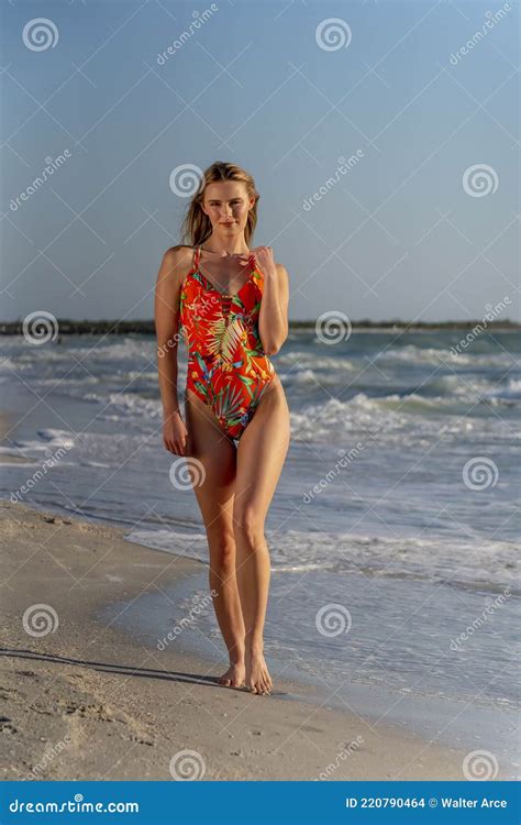 Lovely Blonde Bikini Model Posing Outdoors On A Caribbean Beach Stock