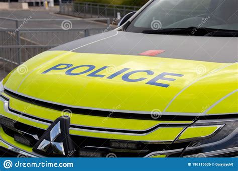 British Police Motorcyclist Passing A Police Van At A Red Stop Traffic ...