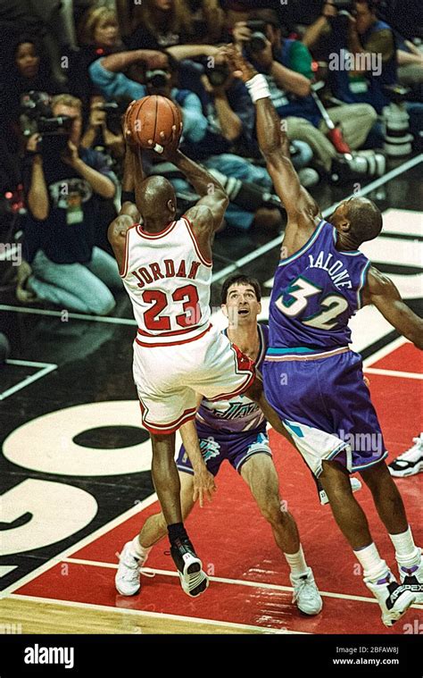 Michael Jordan competing against Karl Malone and John Stockton of the ...