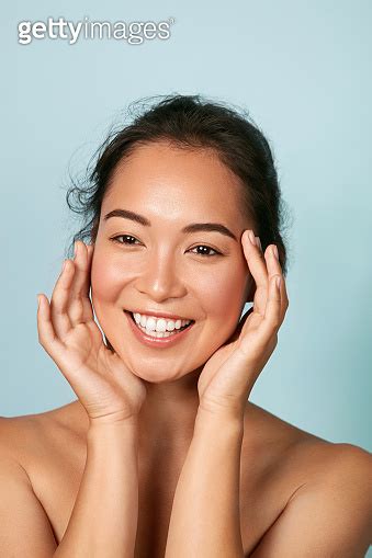 Beauty Face Smiling Asian Woman Touching Healthy Skin Portrait