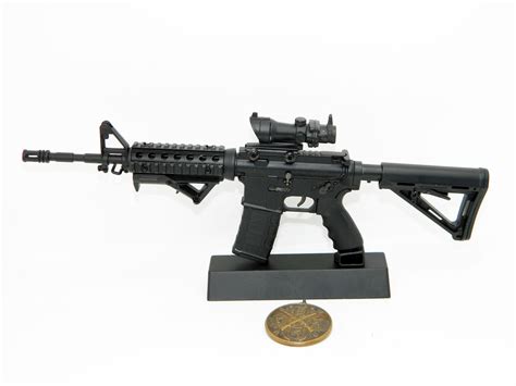 Rifles Model Colt M4A1 tactical automatic rifle on a scale of 1:4 $74 Buy