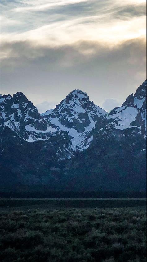 mountains - kanye west “ye” album cover wallpaper : r/iphonewallpapers