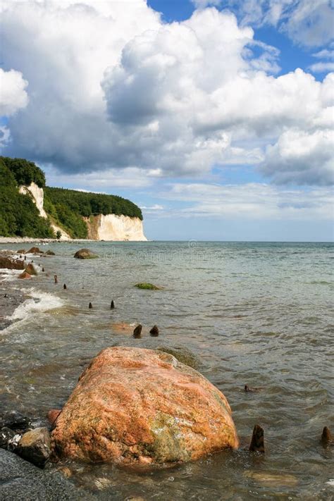 Ruegen Island Beach With Baltic Sea And Chalk Cliffs In The Background