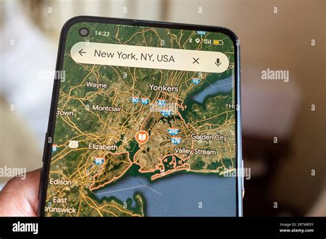 Madrid, Spain 09 14 2023: Screen of a mobile phone with the map of New York city on the Google ...