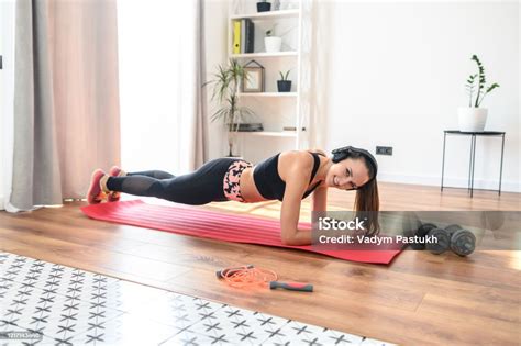 Young Woman Doing Full Body Workout At Home Stock Photo - Download