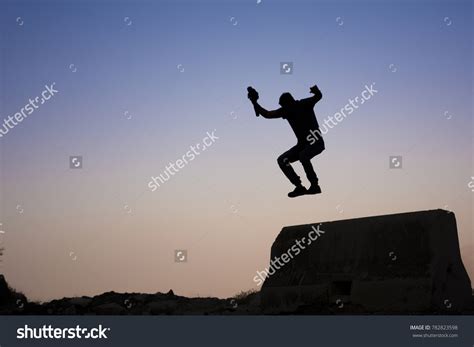 Jumping Silhouette Photographer Sunset Background Stock Photo 782823598 ...