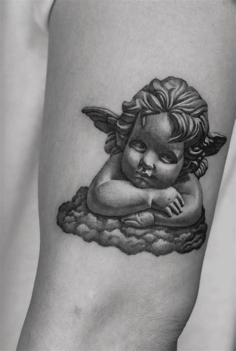 Baby Angel Tattoos On Chest