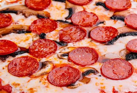 Premium Photo Pepperoni Pizza With Sausage Close Up