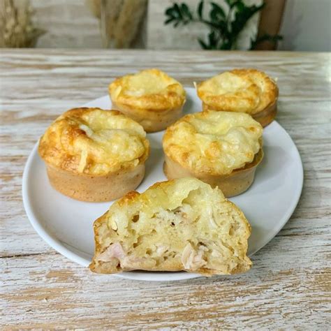 Four Mini Quiches On A White Plate