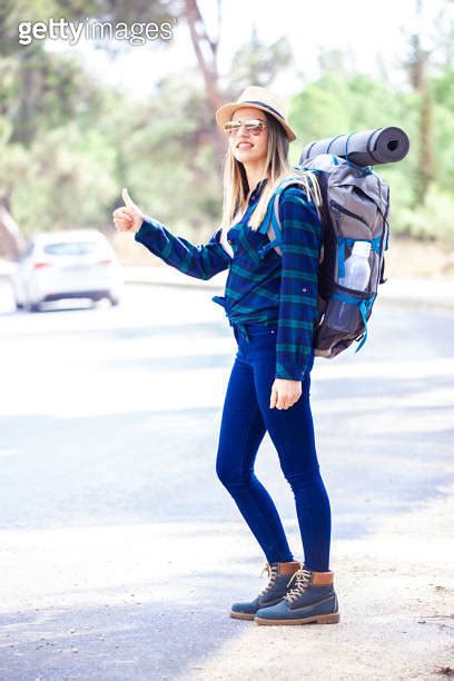 Young Woman On Vacation Hitchhiking Along Country Road 이미지 1849946618