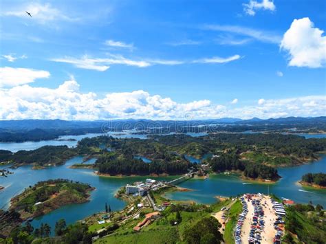 Aerial Shot Of Guatape Dam Under A Blue Cloudy Sky In Colombia Stock