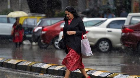 Weather Update Rain Lashes Parts Of Delhi Ncr Imd Issues Red And