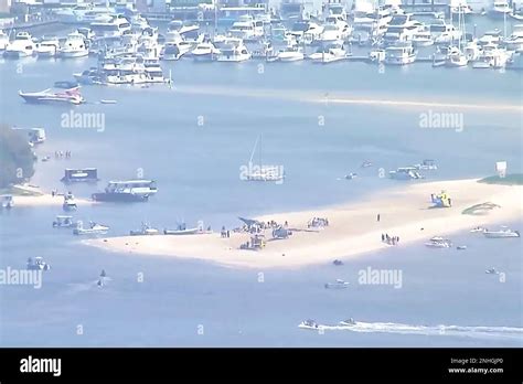 This Image Made From A Video Shows Sand Bank With Crashed Helicopter On