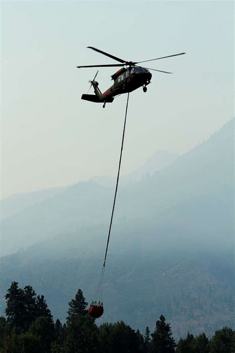 A UH 60 Black Hawk Helicopter Takes Off From A Helipad NARA DVIDS