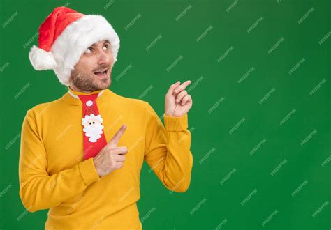 Free Photo Impressed Young Caucasian Man Wearing Christmas Hat And