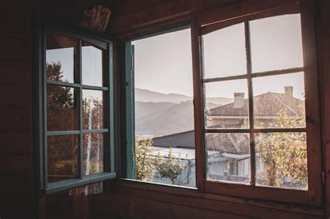 Premium Photo | Open window in village house, view from inside. Mountains view from window ...