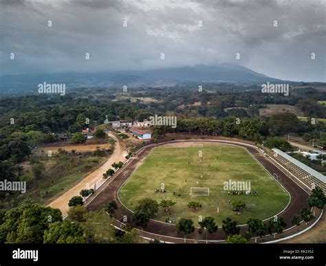 aerial view of rural soccer field stadium in latin America Guatemala ...