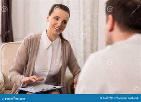 Cheerful Beautiful Psychologist Working With Her Patient Stock Image