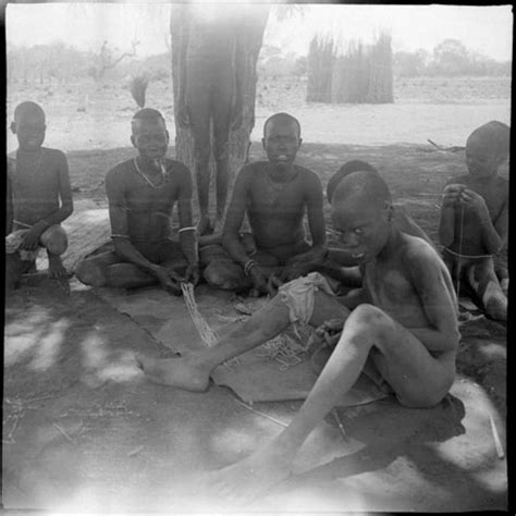 Mandari Youths Making Bead Strings From The Southern