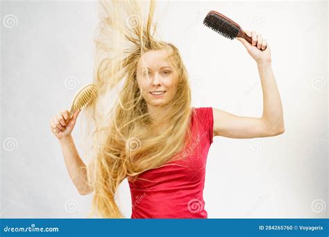 Blonde Girl Long Tangled Hair Holds Two Brushes Stock Photo Image Of
