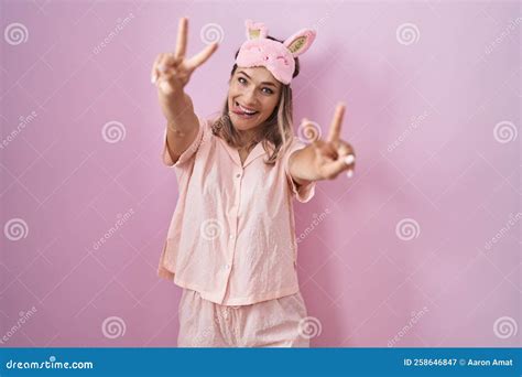 Blonde Caucasian Woman Wearing Sleep Mask And Pajama Smiling With