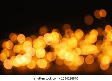 Gold Glitter Bokeh Effect On Dark Stock Photo 1334228870 Shutterstock