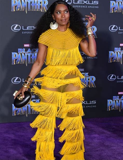 Angela Bassett In Yellow Fringe Jumpsuit For Black Panther Premiere