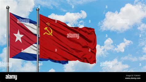 Cuba and Soviet Union flag waving in the wind against white cloudy blue ...