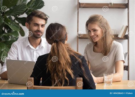 Friendly Smiling Partners Meeting Female Client Or Job Candidate Stock