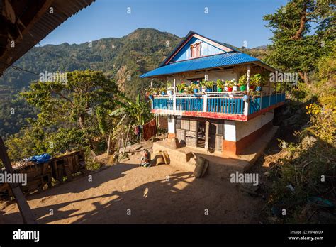 Taplejung Nepal 13 December 2016 Woman Sitting In Front Of A Traditional Newari House 13