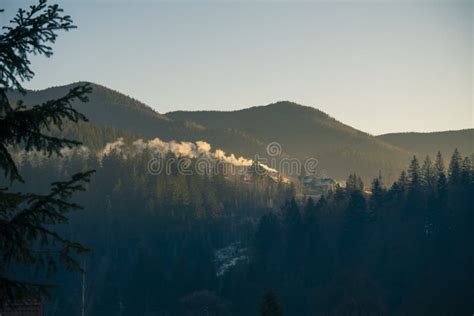 Cozy House In Mountains At Foggy Morning Misty Landscape In The