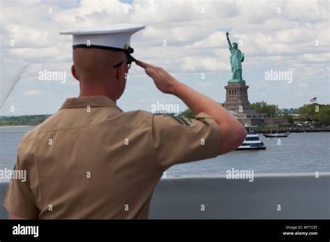 U S Marine Corps Cpl James Dunlap Renders Honors While Passing The